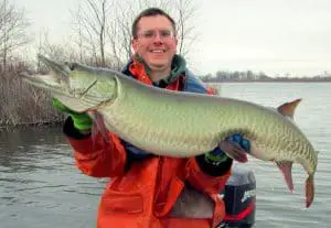 Fisherman with big muskie fish
